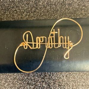 Gold Wire Dorothy script pin.